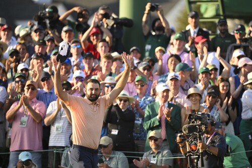 AUGUSTA, GEORGIA - APRIL 14: Scottie Scheffler celebrates at the 18th green after winning for the second time at Masters Tournament at Augusta National Golf Club on April 14, 2024 in Augusta, Georgia. (Photo by Ben Jared/PGA TOUR via Getty Images)