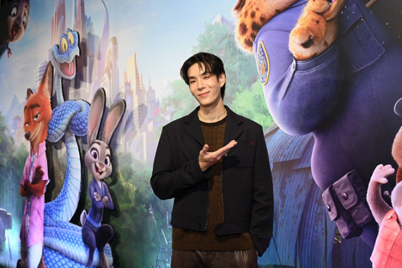 A person standing in front of a mural

AI-generated content may be incorrect.