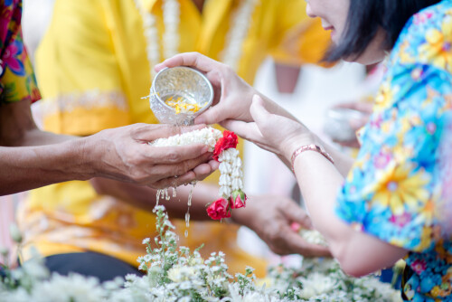 close up hand holding flower song kan tradition thailand